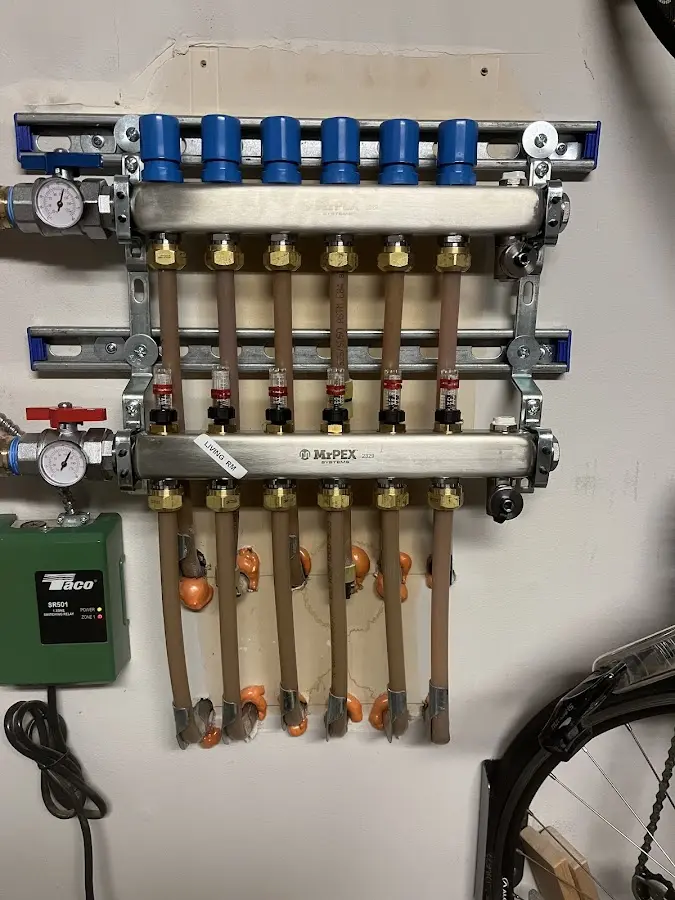 Plumber performing Water Heater Repair at a residential property in Kingwood